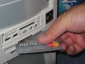 inserting credit card into computer