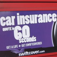 car insurance quote sign on back of bus