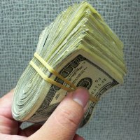 wad of cash in hand